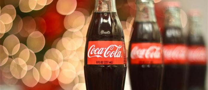 Выручка Coca-Cola тает из-за доллара